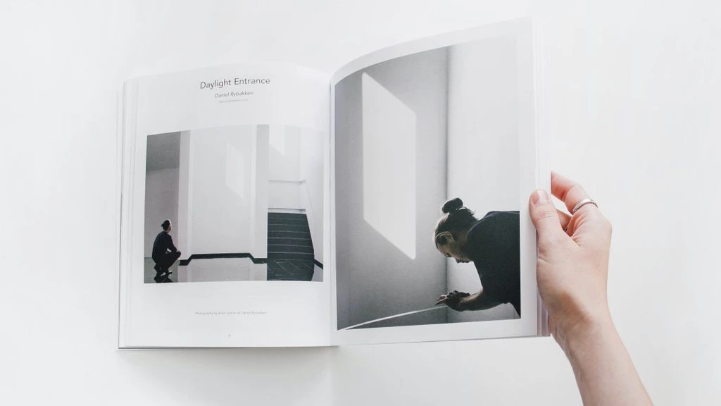 Two-page day-by-day itinerary spread with marginal food photography